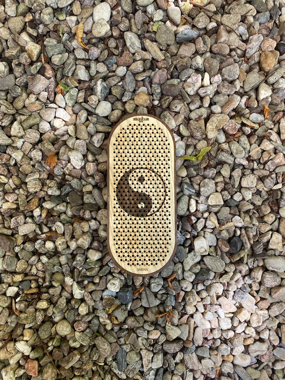 Wooden board with metal nails