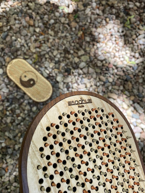 Wooden board with metal nails