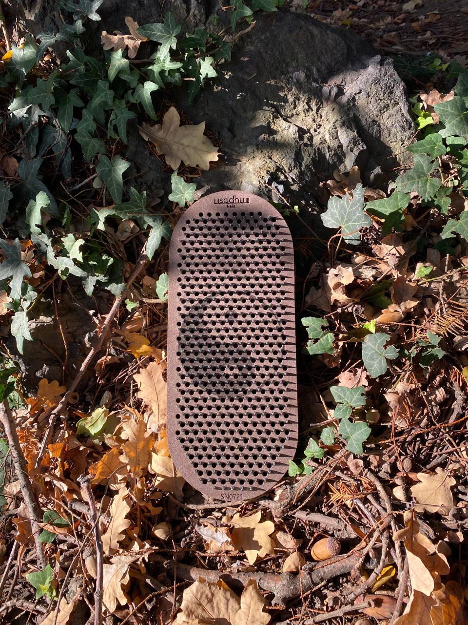 Flexible rubber board with metal nails