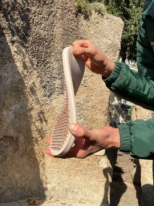 Flexible rubber board with metal nails